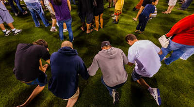 On knees in prayer On knees in prayer
