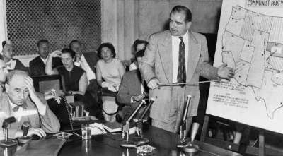 Senator Joe McCarthy (far right) Senator Joe McCarthy (far right)