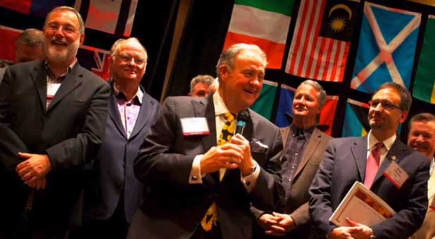 John P. Kelly (with microphone) and other ICAL figures at an event John P. Kelly (with microphone) and other ICAL figures at an event