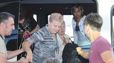 Members of Ezra International assist Russian Jews at the Kiev Airport before they make their Aliyah to Israel. Making Aliyah