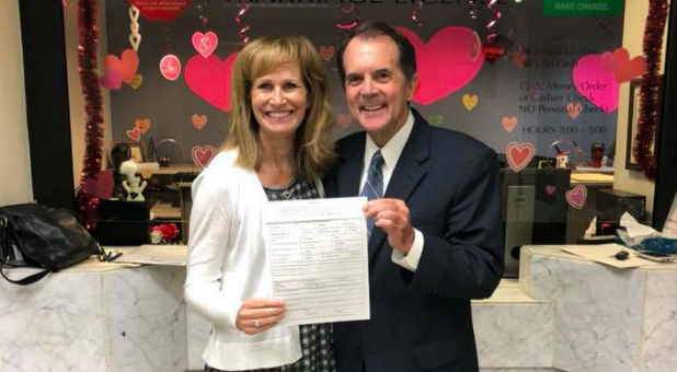 Faye Tharp and Rich Bott show off their marriage license. Faye Tharp and Rich Bott show off their marriage license.