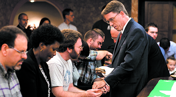 Asbury Seminary President Dr. Timothy Tennent serves Communion to students.